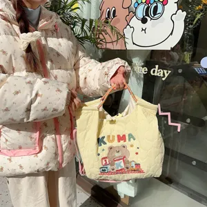 Cream quilted canvas tote bag with cute bear embroidery and large capacity for women.