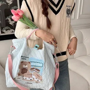 Light blue quilted canvas tote bag with cute bear embroidery, casual crossbody handbag.