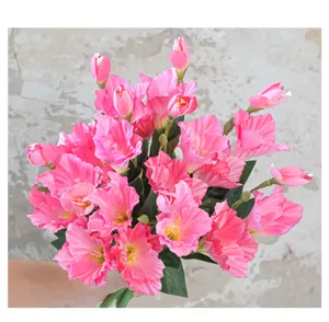 Close-up detail shot of artificial pink gladiolus bouquet, perfect for floral decoration and photo props.