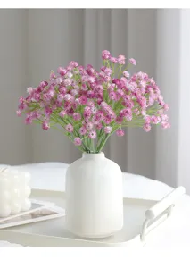Artificial gypsophila flowers detail view, pink plastic baby breath for wedding home decor.