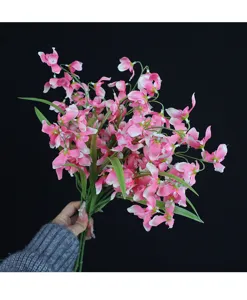 Artificial phalaenopsis flowers branch pink orchid home decoration detail close up