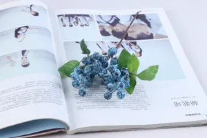 Medium single stem Australian berries artificial flower, elegant blue faux floral home decor detail.