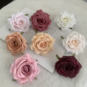 Artificial rose flower heads for wedding decoration, DIY craft projects, and party decor.