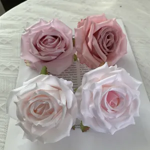 Artificial rose heads faux silk flowers for wedding decoration and DIY craft supplies.