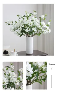 Artificial flower arrangement with white ceramic vase for home decor living room table