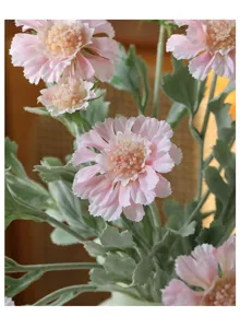 Detailed close-up shot of pink flocked artificial cosmos flower with soft touch floral decor.