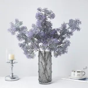 Artificial purple fluffy grass plant in grey glass vase for home wedding room decor