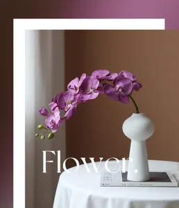 Detailed view of artificial purple phalaenopsis orchid in white ceramic vase for decor.