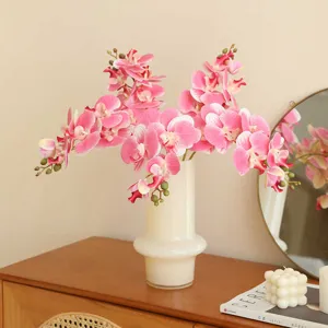 High-quality artificial Phalaenopsis orchids in a white vase, perfect for home living room and café decor.