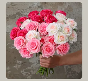 Close-up detail of artificial rose bouquet showing delicate petals and vibrant pink white colors.