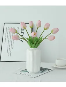 Artificial pink tulip flower bouquet with white ceramic vase for home indoor decor.