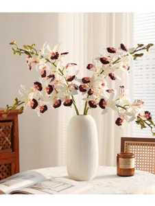 Artificial orchid flower branches detail view, high quality soft rubber floral arrangement decor.