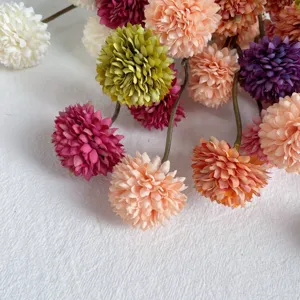 Close-up detail of colorful artificial pompom chrysanthemum flowers, fresh style home decor.