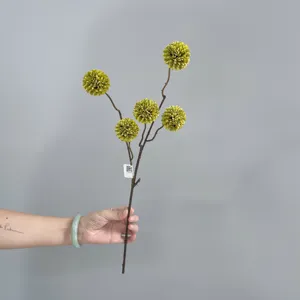 Artificial autumn pompom chrysanthemum detail, single stem fake flower for home decor.