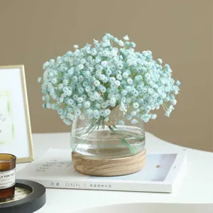 Artificial blue baby's breath flowers bouquet with glass vase for home wedding decor.