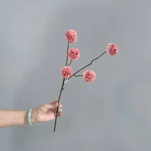 Artificial pompon chrysanthemum detail view, single branch pink flower, home decor.
