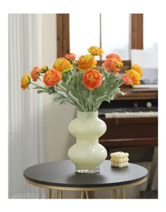 Artificial ranunculus peony flower bouquet in glass vase home decor floral arrangement detail