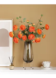 Artificial ranunculus flower bouquet in glass vase, elegant home decor faux floral arrangement.