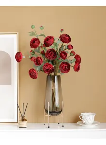 Artificial ranunculus flower bouquet in grey glass vase with gold stand for home decor.