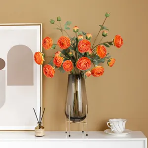 Artificial Ranunculus silk flowers bouquet in glass vase with metal stand home decor.