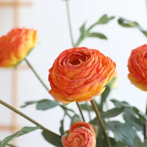 Artificial orange ranunculus silk flowers bouquet for home table decor and floral arrangement.