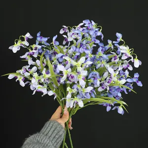 Artificial blue orchid flower bouquet for home decoration, hotel interior and party layout.