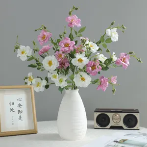 Realistic artificial rose bouquet in white ceramic vase, elegant home decor for living room table.