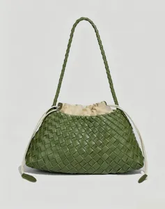 Green woven leather shoulder bag detail, intrecciato design with drawstring closure.