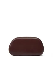 Detailed close-up view of the dark brown hard case clutch bag featuring a smooth curved pebble shape.