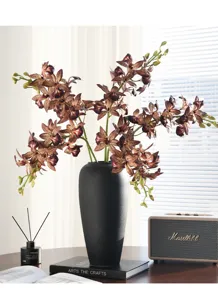 Detailed view of artificial orchid branches in a black vase, creating a modern Chinese decor style.