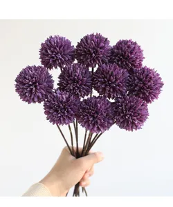 Detail shot of artificial purple pompon chrysanthemum flower ball for decor and arrangement.