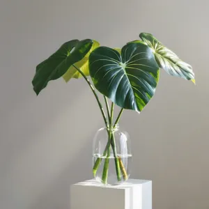 Artificial philodendron leaves in glass vase for modern home and hotel decor main view