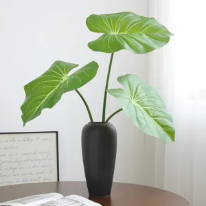 Artificial philodendron anthurium leaves potted plant for home living room decor.