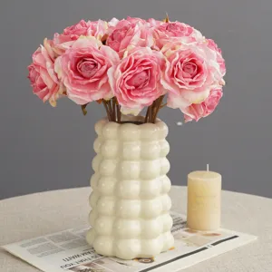 Artificial pink rose flower bouquet with ceramic vase, perfect for home decor and wedding setup.