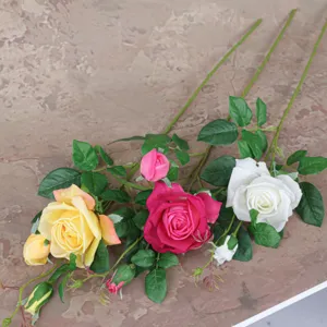 Artificial rose flowers with long stems and green leaves for home decor and table decoration.