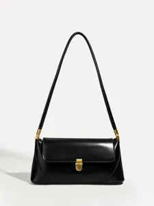Black leather baguette shoulder bag detail featuring elegant gold tone metal clasp closure.