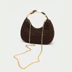 Elegant brown woven crescent handbag with gold metal handle and chain strap for women.