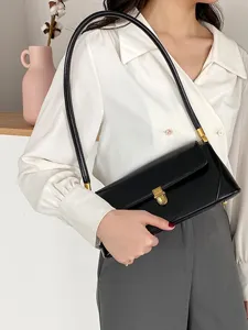 Minimalist black leather shoulder bag with gold tone hardware for women vintage underarm bag.