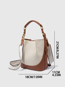 Elegante Damen Segeltuch Eimer Tasche mit breitem Schultergurt und Lederoptik für den Alltag.