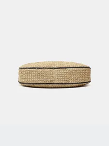 Stylish straw woven shoulder dumpling bag with chic black piping, minimalist casual design.