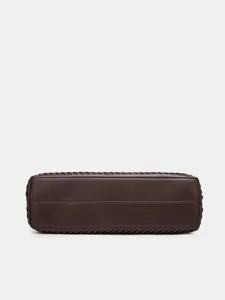 Dark brown woven leather handbag bottom detail shot, premium craftsmanship and texture display.