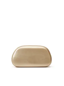 Close-up of smooth gold metallic hard shell clutch bag surface with modern pebble design.