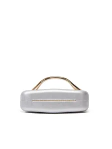 Detailed view of a silver box clutch bag with elegant gold metal handle for evening party.