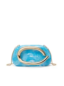 Close-up detail of blue marble acrylic box clutch bag with bold gold metal C clasp and chain.