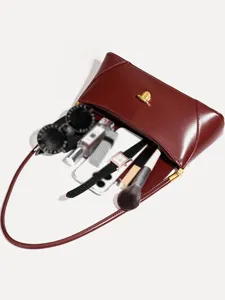 Burgundy underarm shoulder bag for women, elegant faux leather vintage purse with spacious interior.