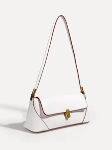 Close-up detail view of white leather shoulder bag featuring red edge and gold clasp.