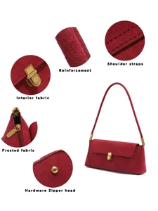 Detailed view of burgundy suede shoulder bag showcasing soft frosted fabric texture and metal hardware.