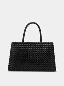 Close-up view of the black woven leather texture and exquisite handle detail of the designer bag.