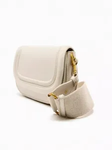 Chic off-white saddle crossbody bag for women with wide fabric strap and gold hardware.