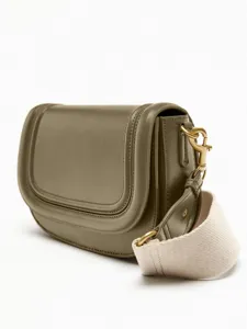 Olive green saddle crossbody bag detailed view, featuring decorative topstitching and wide strap.